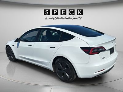 2021 Tesla Model 3 — rear three-quarter view
