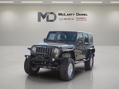 2015 Jeep Wrangler Unlimited — rear three-quarter view