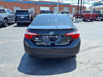 2014 Toyota Corolla — rear three-quarter view