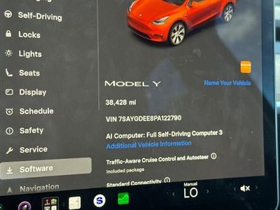 2023 Tesla Model Y — rear three-quarter view
