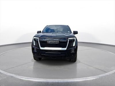 2025 GMC Sierra EV — rear three-quarter view