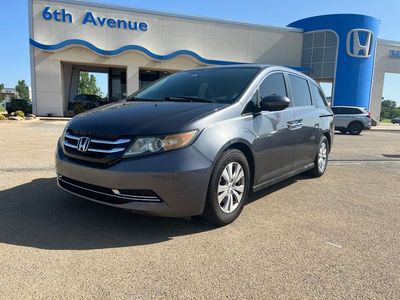 2016 Honda Odyssey SE in Modern Steel Metallic — front three-quarter view