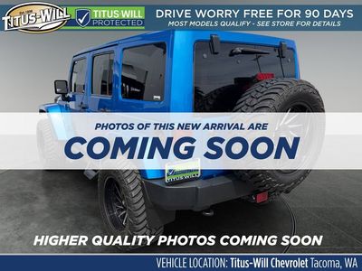 2015 Jeep Wrangler Unlimited — rear three-quarter view