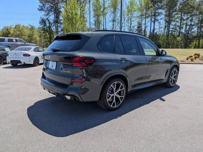 2026 BMW X5 — rear three-quarter view