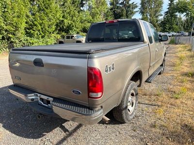 2003 Ford F-150 — side profile view