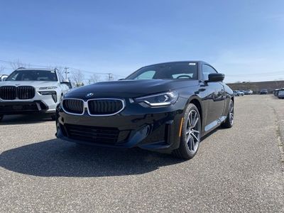 2025 BMW 2 Series 230i xDrive in Black Sapphire Metallic — front three-quarter view