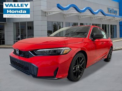 2026 Honda Civic Hatchback Sport in Rallye Red — front three-quarter view