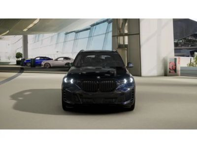 2026 BMW X5 — rear three-quarter view