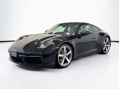 2024 Porsche 911 Carrera in Jet Black Metallic — front three-quarter view