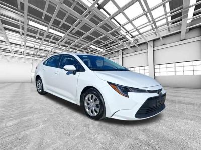 2025 Toyota Corolla LE in White — front three-quarter view