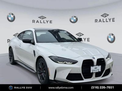 2023 BMW M4 Base in Alpine White — front three-quarter view