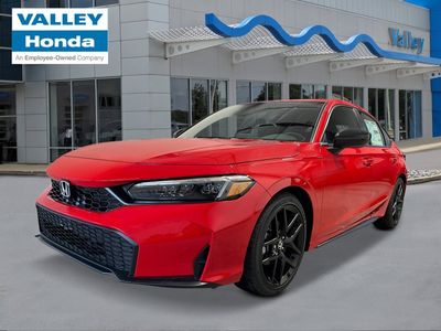 2026 Honda Civic Hatchback Sport in Rallye Red — front three-quarter view