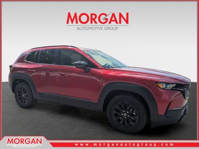 2026 Mazda CX-50 Hybrid Premium in Soul Red Crystal Metallic — front three-quarter view