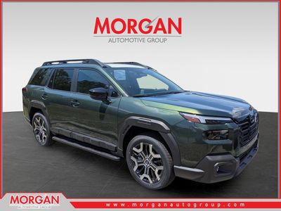 2026 Subaru Outback Touring XT in Deep Emerald Green Pearl — front three-quarter view