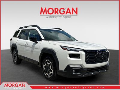 2026 Subaru Outback Touring in Crystal White Pearl — front three-quarter view