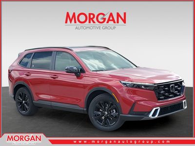 2026 Honda CR-V Hybrid Sport Touring in Radiant Red Metallic — front three-quarter view