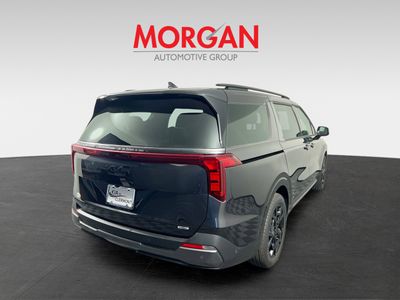 2026 Kia Carnival — rear three-quarter view