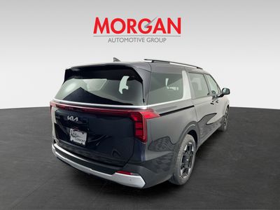 2026 Kia Carnival — rear three-quarter view