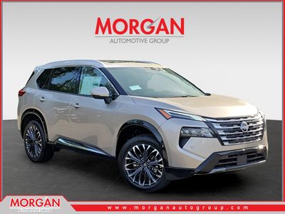 2026 Nissan Rogue Platinum in Gold — front three-quarter view
