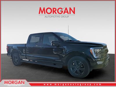 2023 Ford F-150 Lariat in Black — front three-quarter view