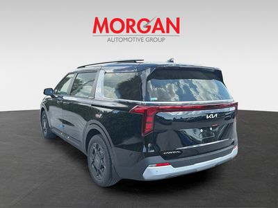 2026 Kia Carnival Hybrid — rear three-quarter view