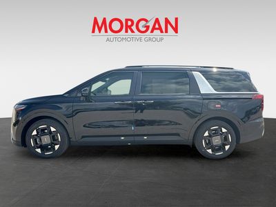 2026 Kia Carnival — rear three-quarter view