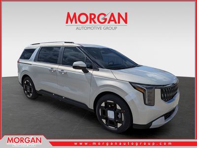 2026 Kia Carnival EX in Ivory Silver — front three-quarter view
