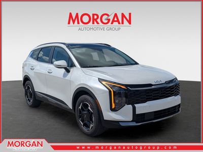 2026 Kia Sportage Hybrid EX in Snow White Pearl — front three-quarter view