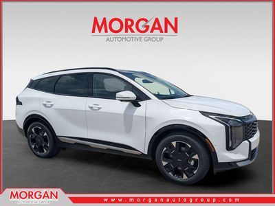 2026 Kia Sportage SX-Prestige in Glacial White Pearl — front three-quarter view