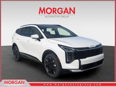 2026 Kia Sportage SX-Prestige in Glacial White Pearl — front three-quarter view