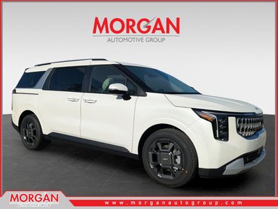 2026 Kia Carnival Hybrid EX in Snow White Pearl — front three-quarter view
