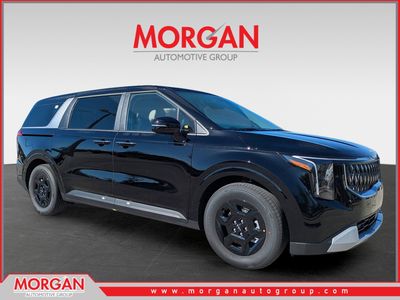 2026 Kia Carnival LXS in Aurora Black Pearl — front three-quarter view
