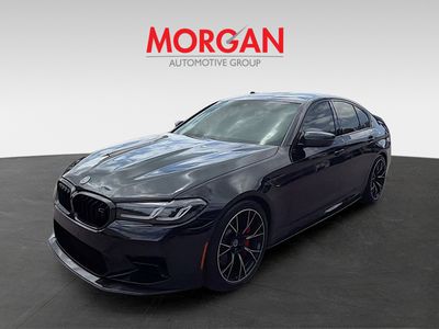 2023 BMW M5 — rear three-quarter view