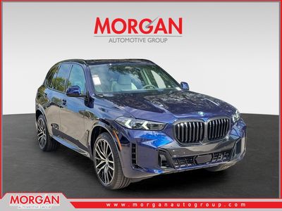 2026 BMW X5 sDrive40i in Tanzanite Blue II Metallic — front three-quarter view