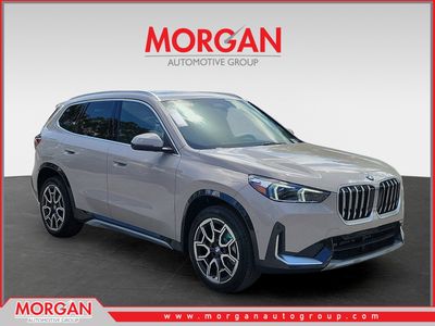 2026 BMW X1 xDrive28i in Dune Grey Metallic — front three-quarter view
