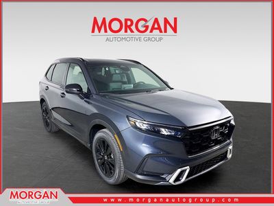2026 Honda CR-V Hybrid Sport Touring in Meteorite Gray Metallic — front three-quarter view