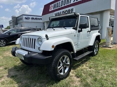 2015 Jeep Wrangler — rear three-quarter view