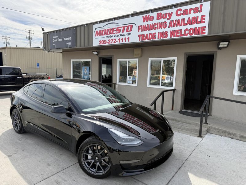 2021 Tesla Model 3 in Black — front three-quarter view