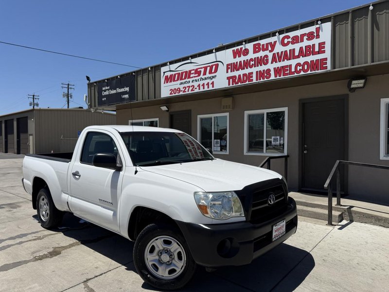 2009 Toyota Tacoma in White — front three-quarter view