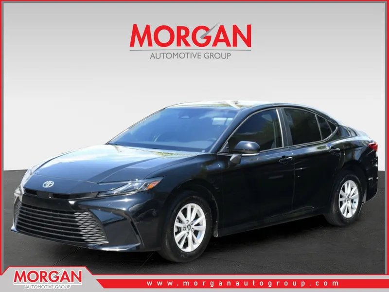 2025 Toyota Camry LE in Midnight Black Metallic — front three-quarter view