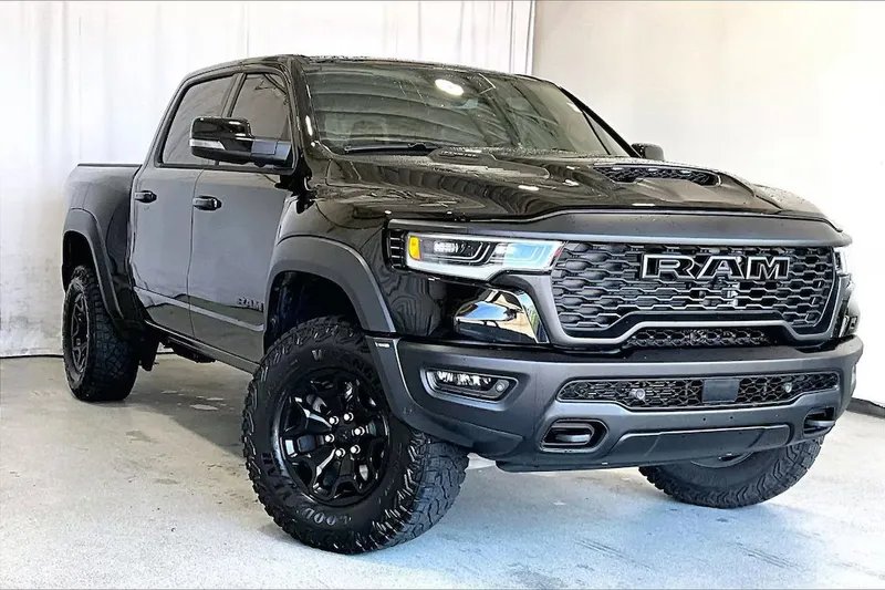 2026 Ram 1500 in Diamond Black Crystal Pearlcoat — front three-quarter view