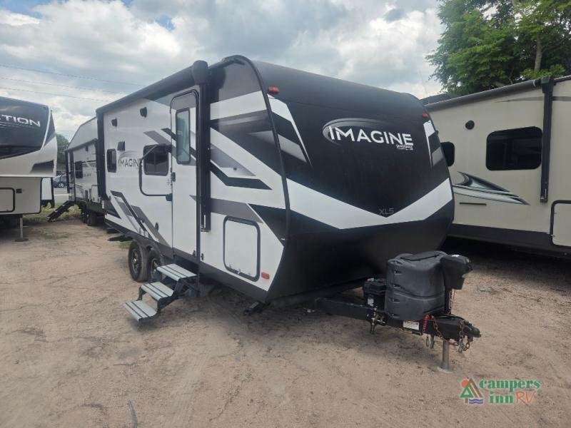 2022 Grand Design Imagine XLS in White fiberglass with graphics — front three-quarter view