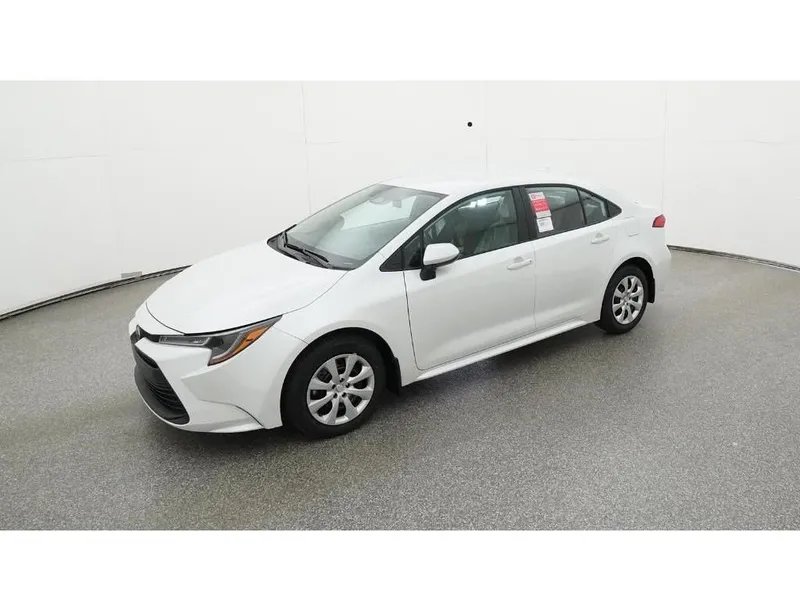 2026 Toyota Corolla LE in Wind Chill Prl — front three-quarter view