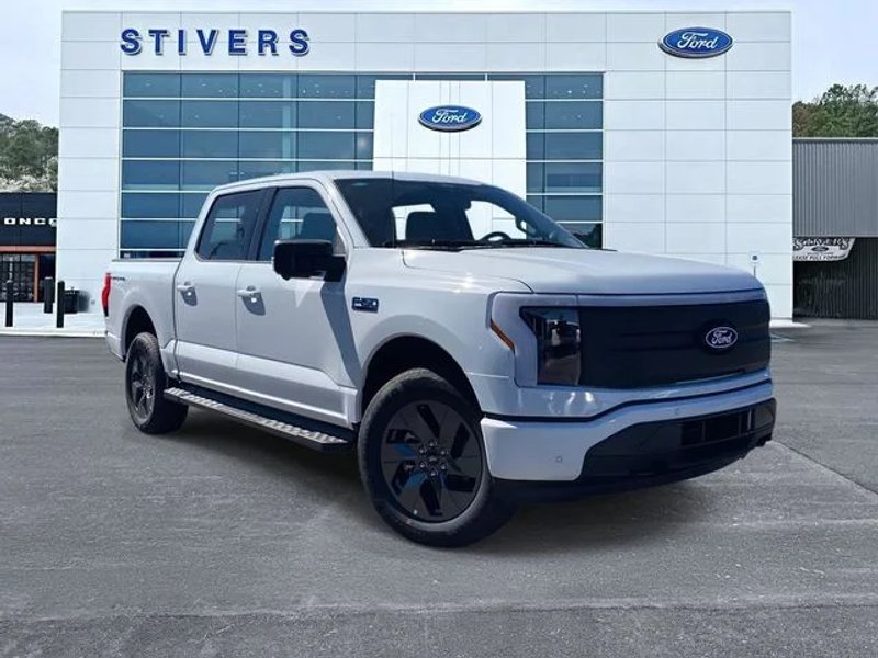 2025 Ford F-150 Lightning Flash in Oxford White — front three-quarter view