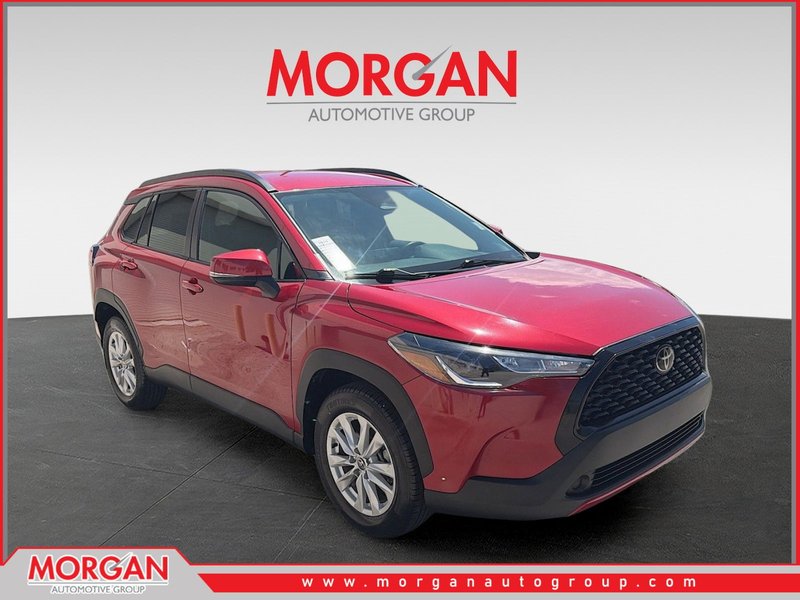 2023 Toyota Corolla Cross LE in Barcelona Red Metallic — front three-quarter view