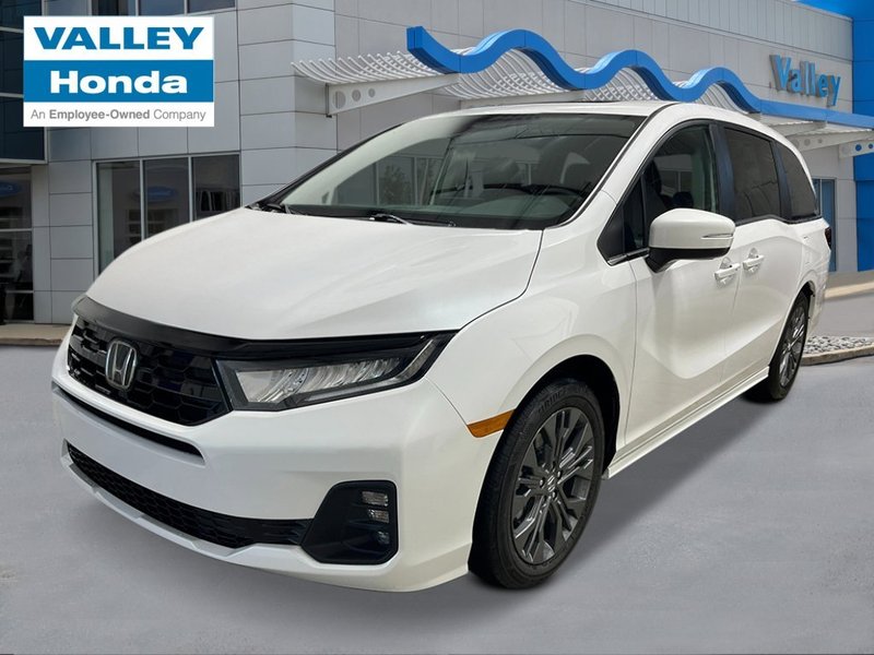 2026 Honda Odyssey Touring in Platinum White Pearl — front three-quarter view