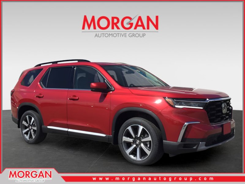 2025 Honda Pilot Touring in Radiant Red Metallic II — front three-quarter view