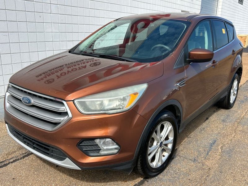 2017 Ford Escape SE in Canyon Ridge Metallic — front three-quarter view