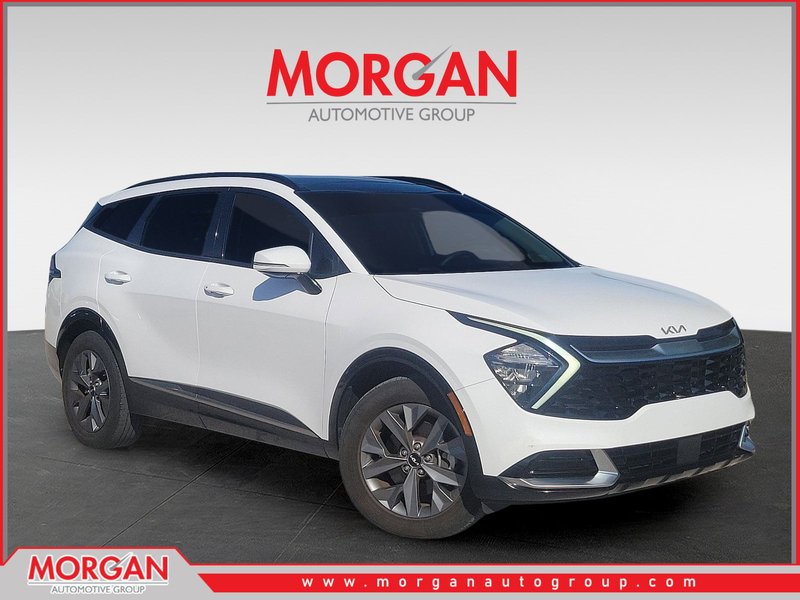 2023 Kia Sportage SX in Glacial White Pearl — front three-quarter view