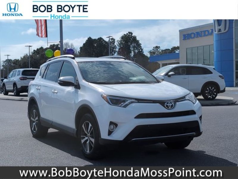 2016 Toyota RAV4 XLE in Super White — front three-quarter view